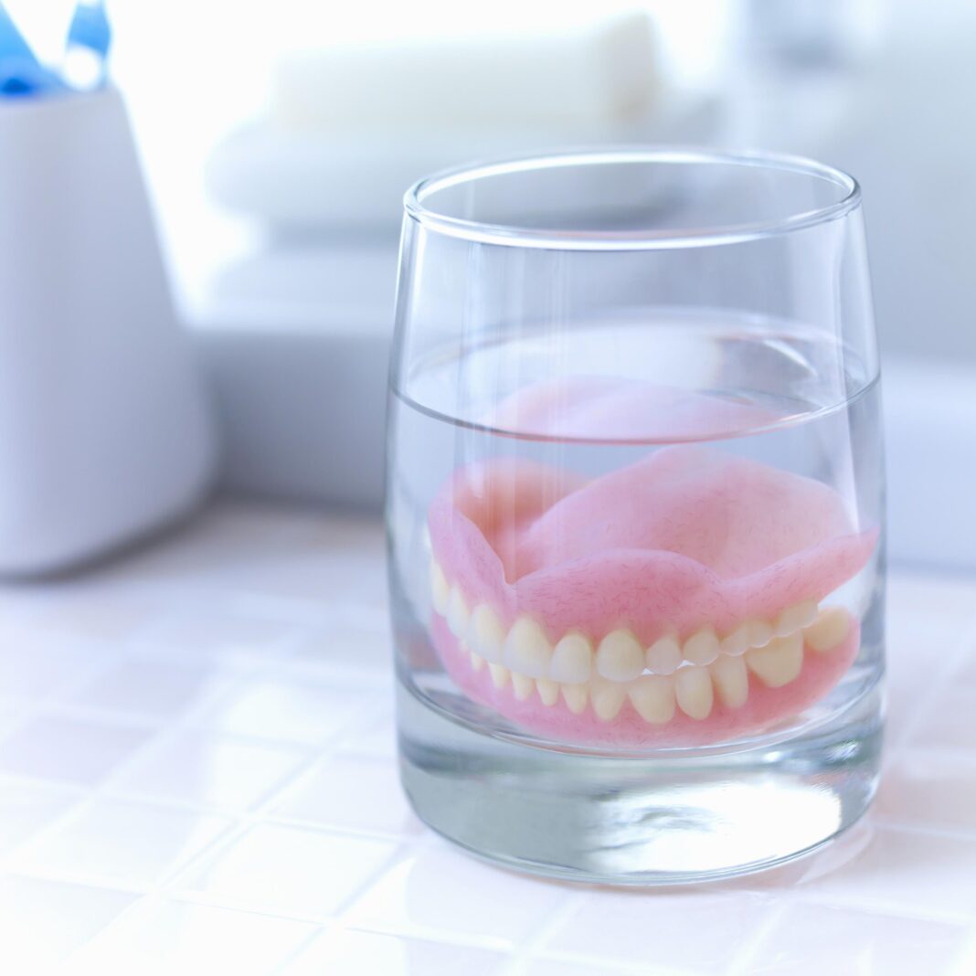 How are artificial dentures made?